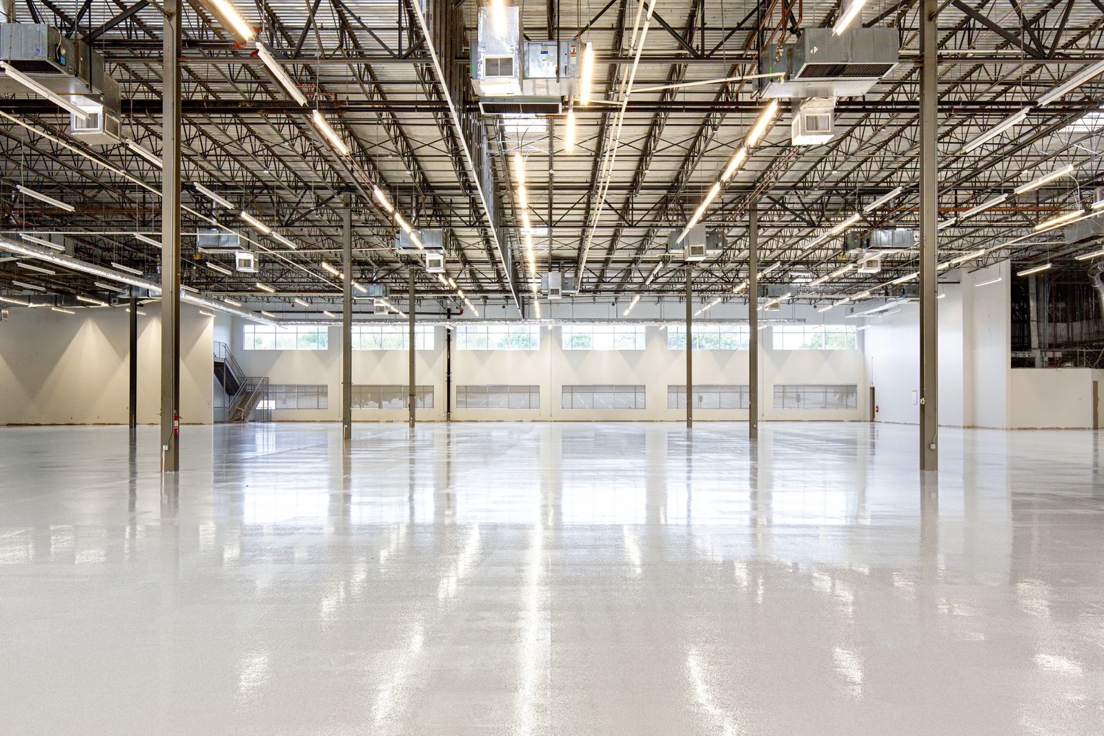 Long glossy commercial floor running between racking