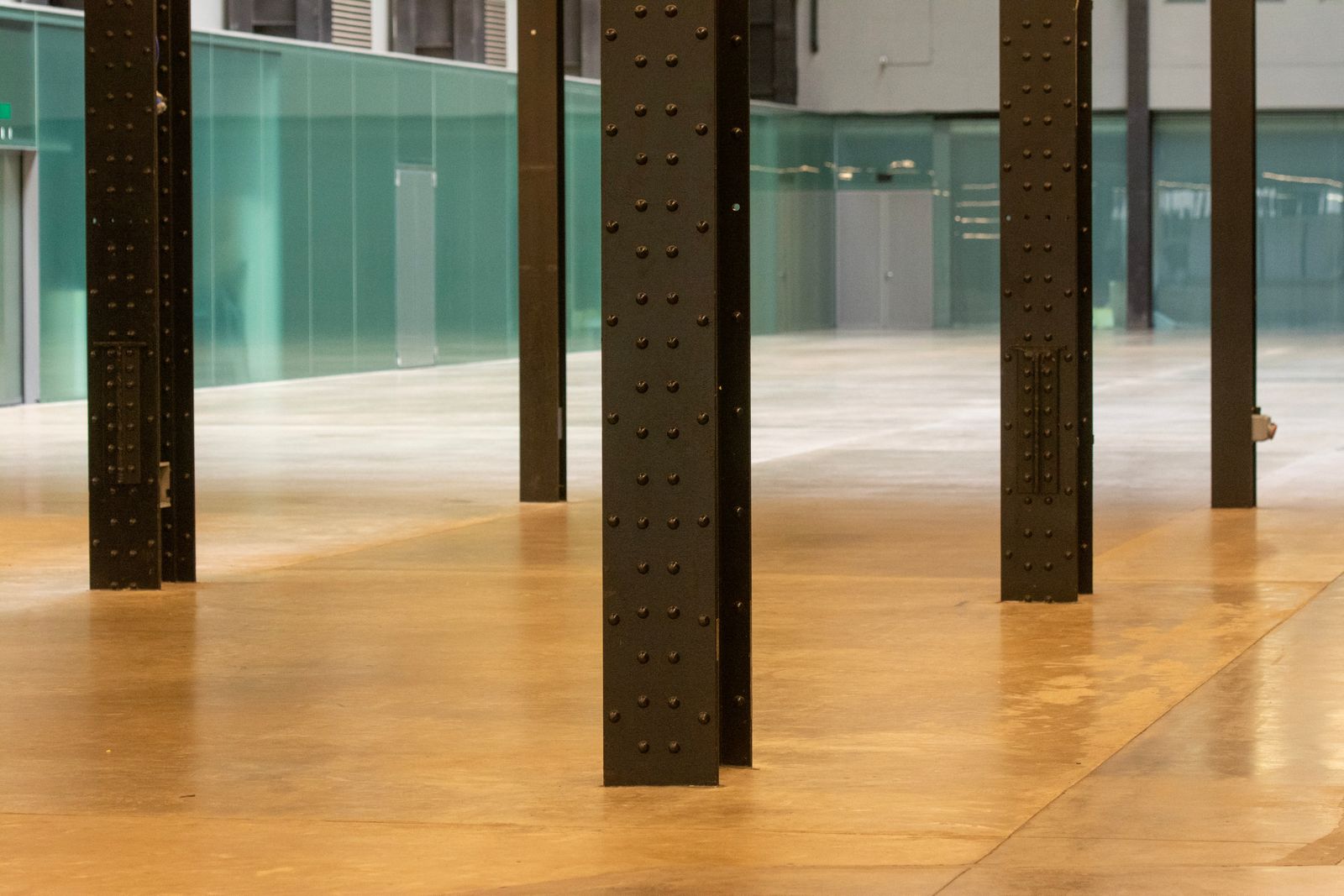 High-gloss commercial floor reflecting the columns above it